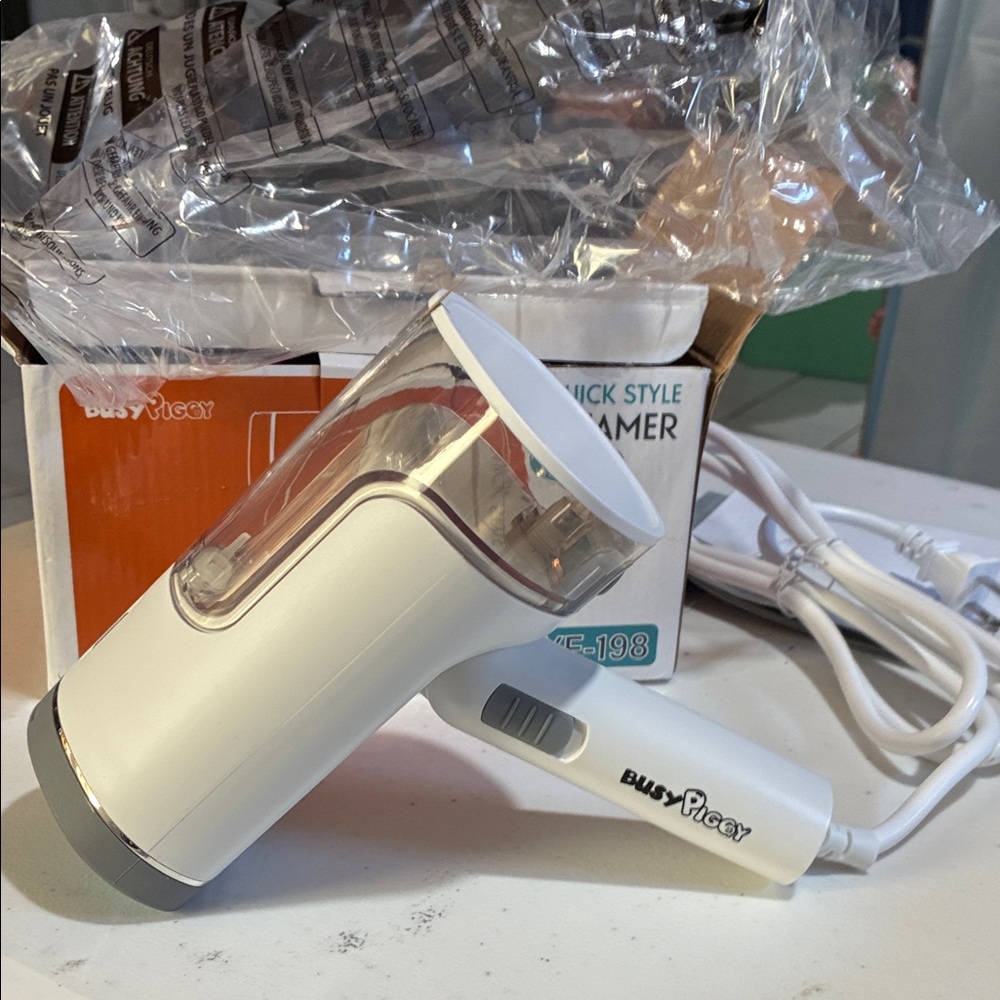 White and Gray Handheld Steamer